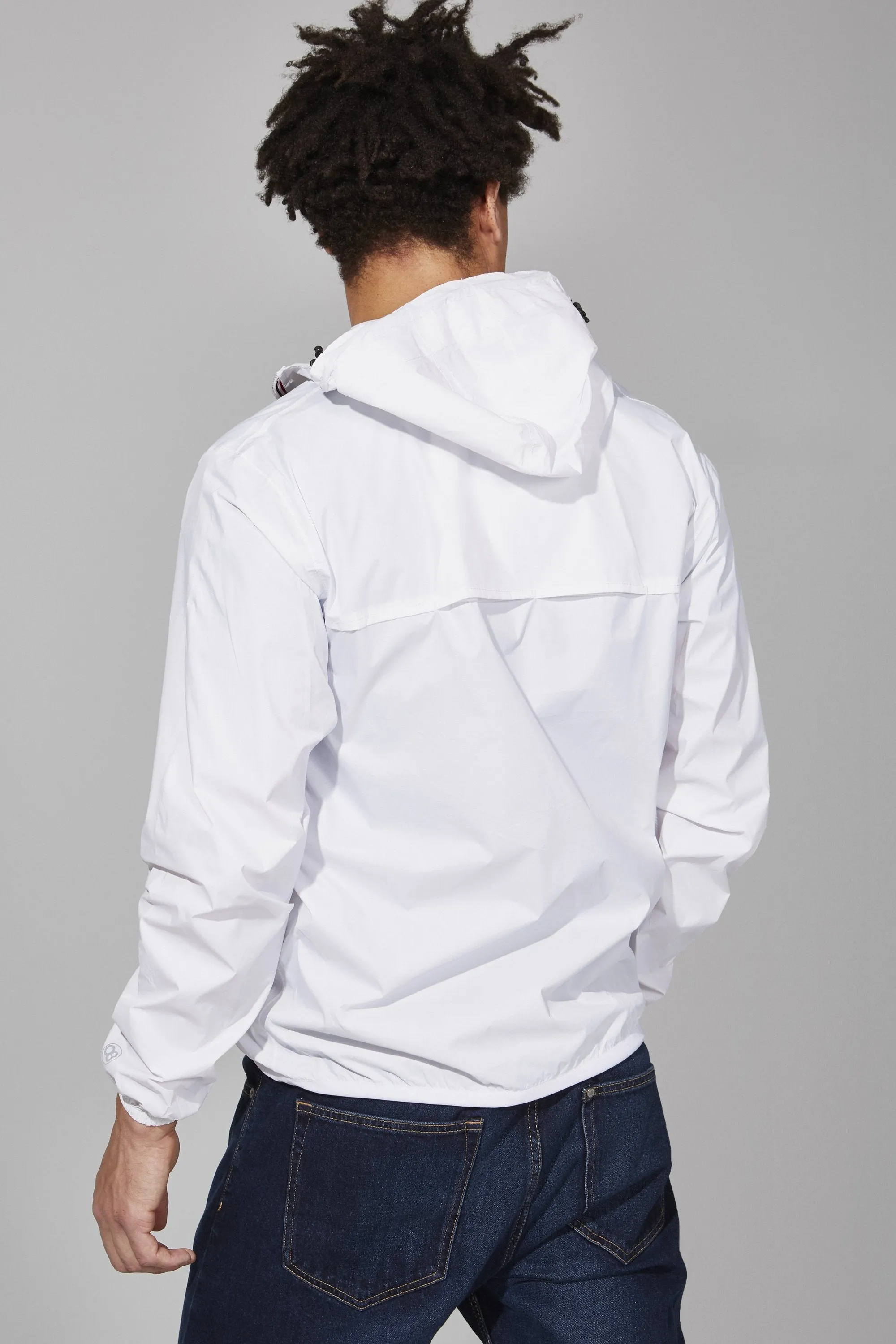 Men's white full zip packable rain jacket and windbreaker